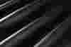 abstract image of rolls of black leather 